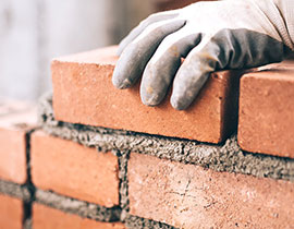 This is an photo of someone laying bricks