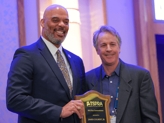  Colbert is shown in this photo holding the TSPRA Key Communicator Award