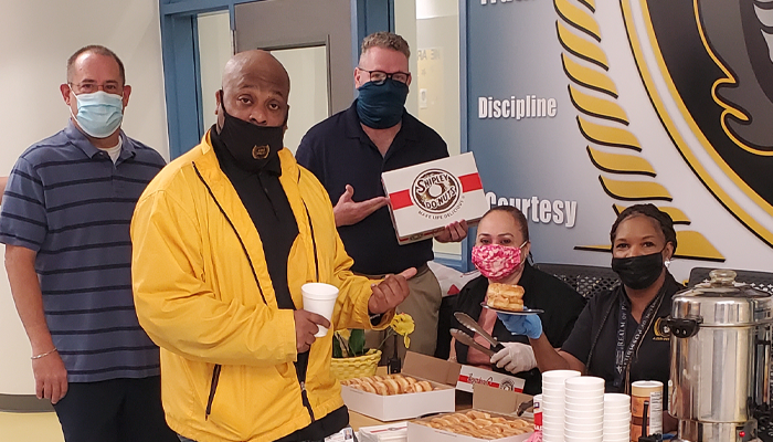June 4, 2021 - ABS West Celebrates Donut Day with Firefighters, staff, and principal, Dr. Victor Keys.