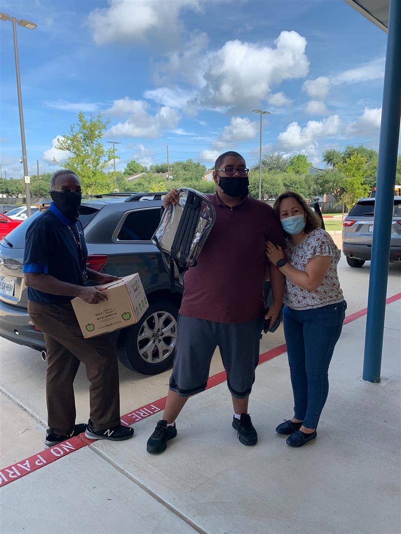 Image of  ABS West Backpack Drive 2021, Dr. Keys, Y. Perez, and Claudia Alvarez.